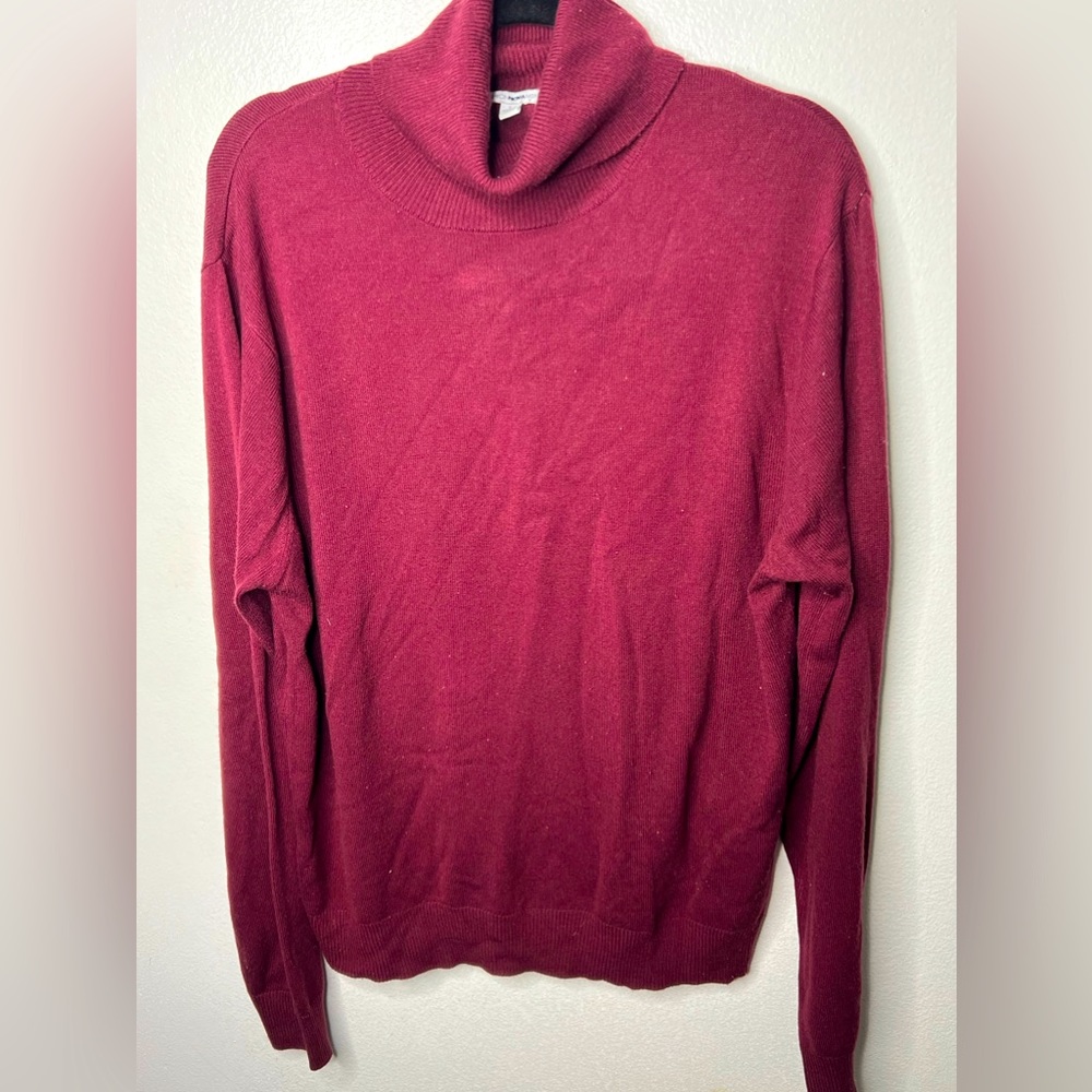 This light weight, maroon, turtleneck sweater in a size large.